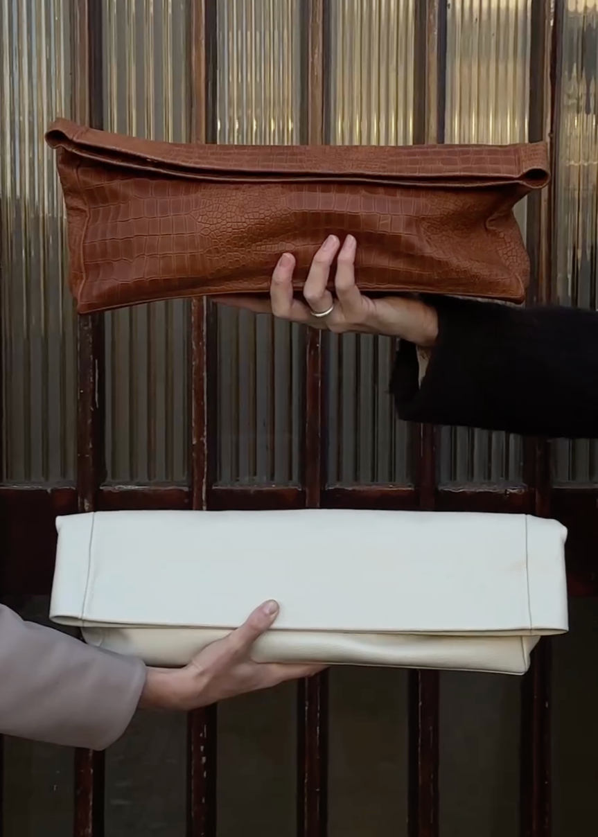 SITUATIONIST LEATHER CLUTCH BAG